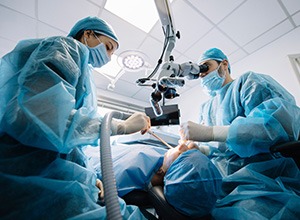 a dentist placing a dental implant
