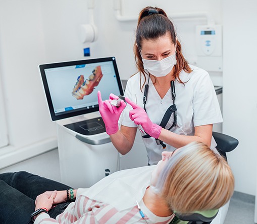 Dentist showing patient clear aligner